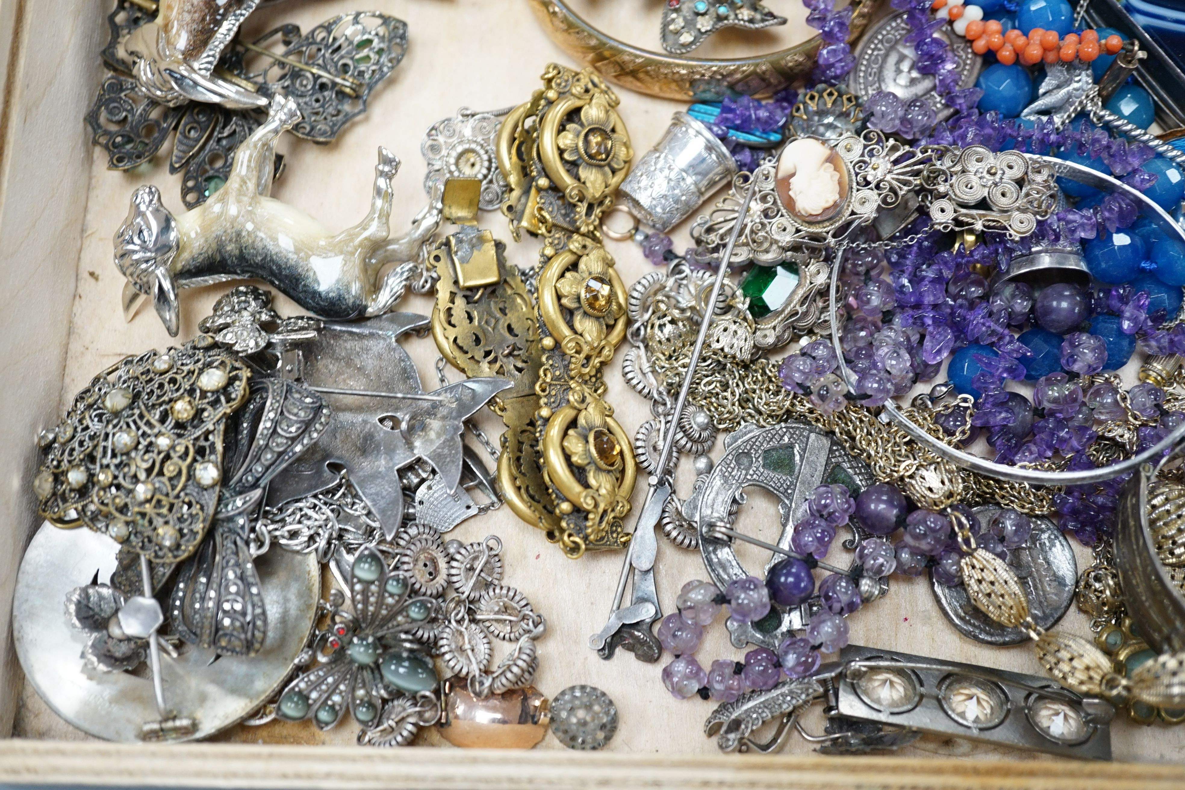 A group of assorted mostly costume jewellery including a Scottish brooch